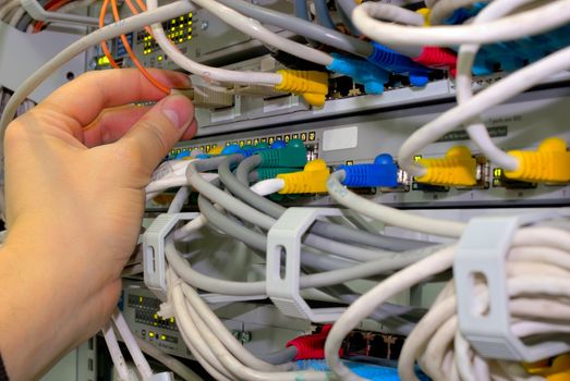 engineer, technician checks fibre network connections