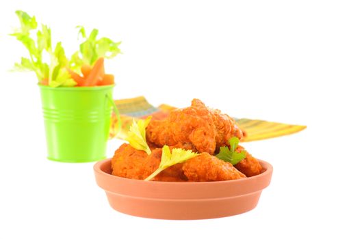 Hot and spicy chicken wings served with crisp vegetables.