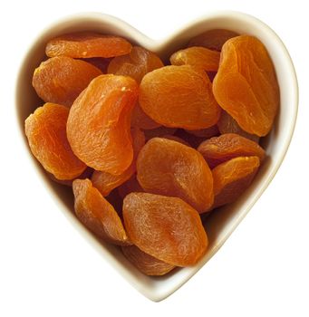 Heart filled with dried apricots, with clipping-path