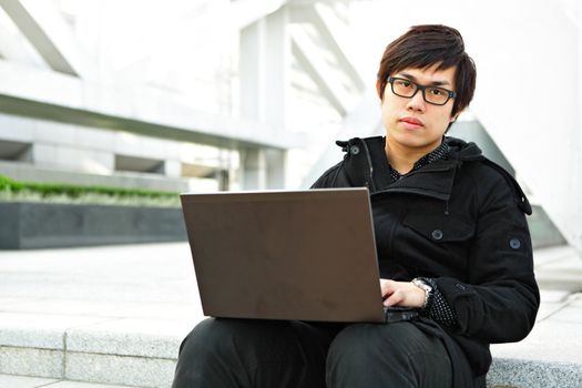 man using computer outdoor