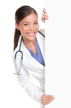 Medical doctor showing billboard sign empty with copy space for text. Beautiful mixed race Chinese Asian / white Caucasian female nurse or young medical professional isolated on white background.