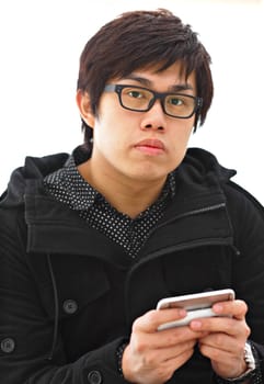 asian man sms on cell phone