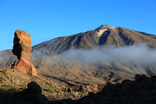 Tenerife. Morning light on Teide and the famous rock, Cinchado at Los Roques.