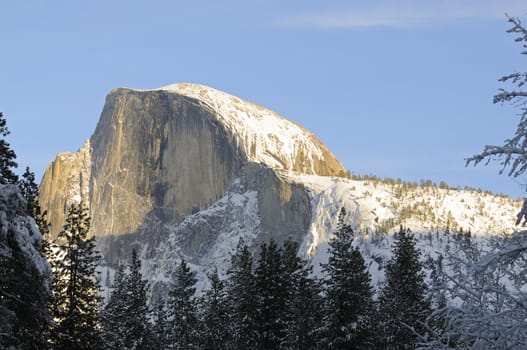 Sun setting on Half Dome in Yosemite valley