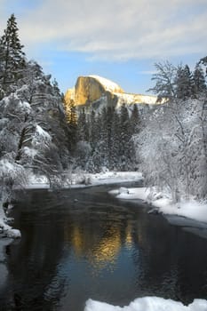 reflection of Sunset on Half Dome in Yosemite National Park along the Merced River banks
