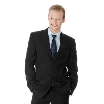 Happy young businessman standing, isoalted on white background