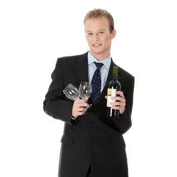 Young handsome business man with bottle of wine and glass , isolated on white