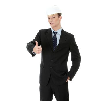 Young businessman in white helmet gesturing ok, isolated on white