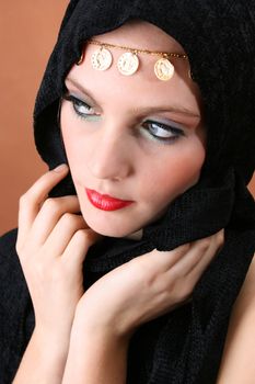 Female model with blue eyes wearing traditional folk dress