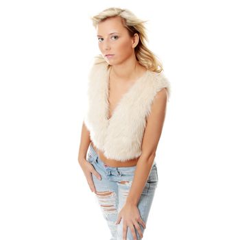 Young sexy woman in jeans and fur, isolated on white