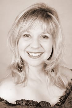 Beautiful blond female against a light background