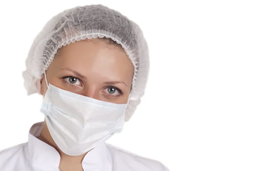 portrait of a young doctor in a medical cap and mask