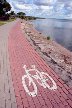 Bicycle path near the lake. Bicycle track sign. Only the bicycle!