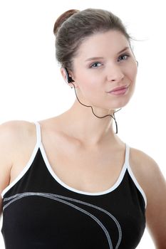 Young fitness woman with sport headphones listening music isolated