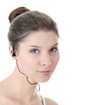 Young fitness woman with sport headphones listening music isolated