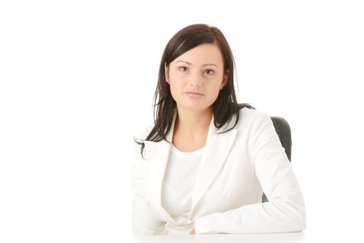 Closeup portrait of woman sitting at the desk isolated