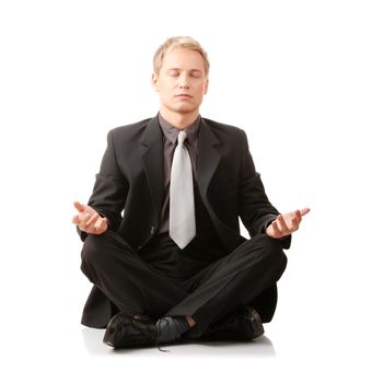 Businessman sitting in lotus position isolated