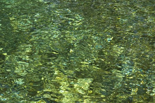 Naturally emerald colored water from an Aegean coast waterfall