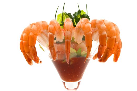 Gourmet large shrimp cocktail with cocktail sauce, lime, lettuce, parsley and chives