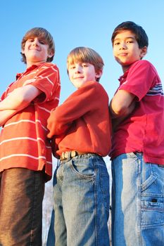Three boys with arms crossed