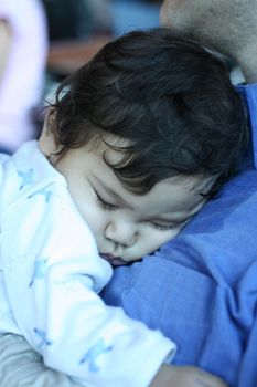 Baby asleep on daddy's chest