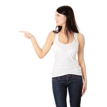 Young beautiful happy caucasian woman pointing on left ,isolated on white