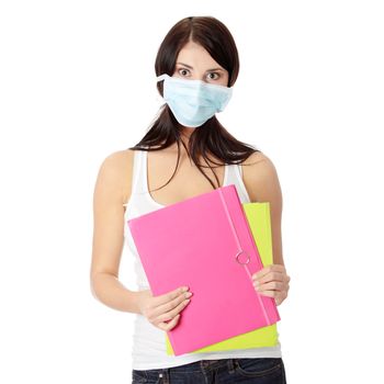 Caucasian student woman with mask on her face. She is defending her self from viruses. Isolated on white