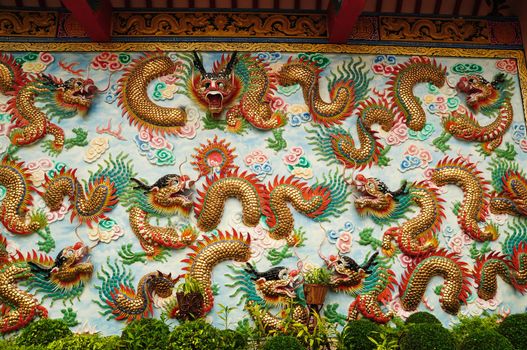 chinese dragon at the wall of temple, Thailand