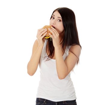 Beautiful caucasian woman eating hamburger. Isolated on white