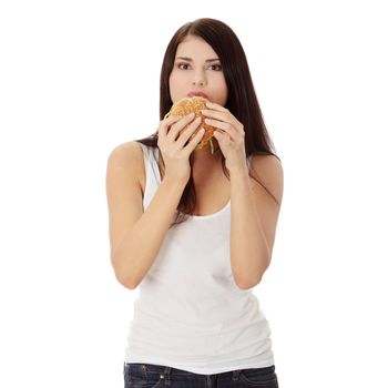 Beautiful caucasian woman eating hamburger. Isolated on white