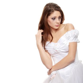 Beautiful young caucasian sad bride crying, over white background