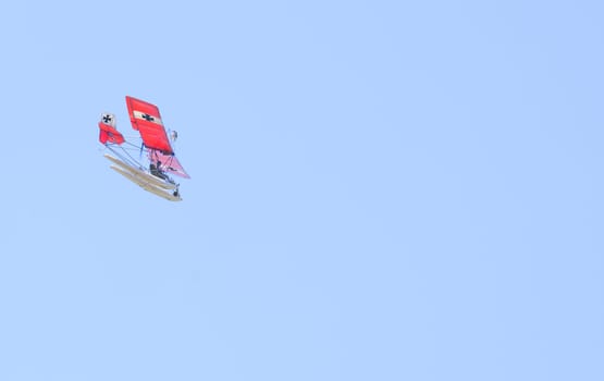 Ultralight aricraft with pontoons and displaying the Insignia of the Red Baron