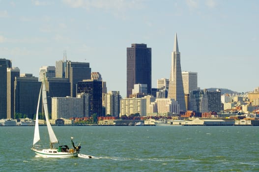 San Francisco Skyline with yacht sailing in the Bay