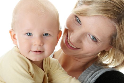 Bright closeup portrait of adorable baby boy and his mom