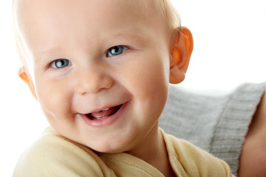 Bright closeup portrait of adorable baby boy and his mom
