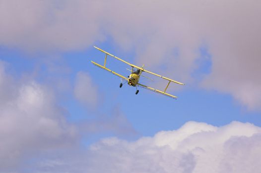 Crop dusting aircraft spraying fields