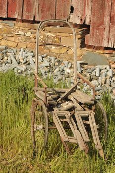 Old dilapidated wheelchair on a farm in Sutter Creek, California