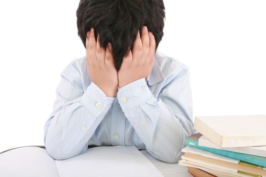 Schoolboy being stressed by his homework, isolated on white background