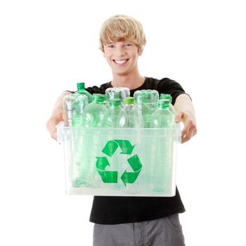 Young man carrying a plastic container full with empty recyclable household material.