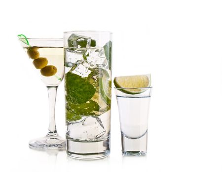 Various cocktails and alcohol on white background