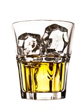 Whiskey on the rocks in an old fashion glass isolated on white