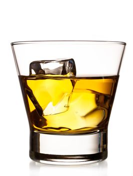 Whiskey on the rocks in an old fashion glass isolated on white