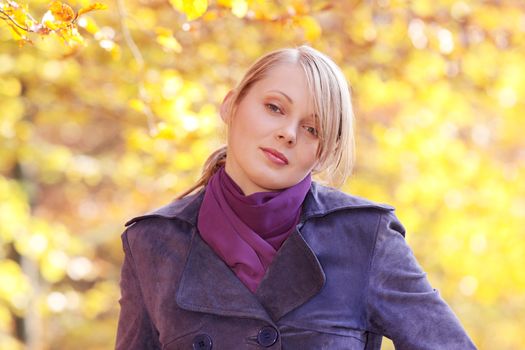 Beautiful young woman in autumn forest