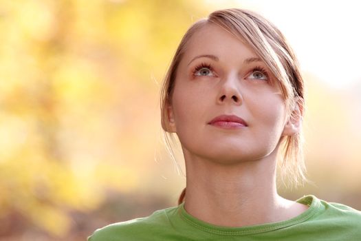 Beautiful young woman in autumn forest