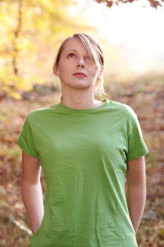 Beautiful young woman in autumn forest