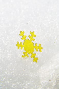 golden snow stars on a real snowy icy surface