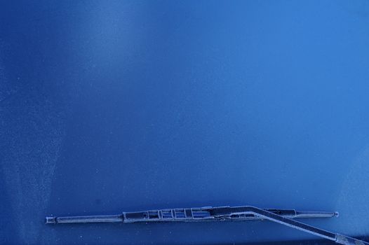 car windshield covered with ice at winter