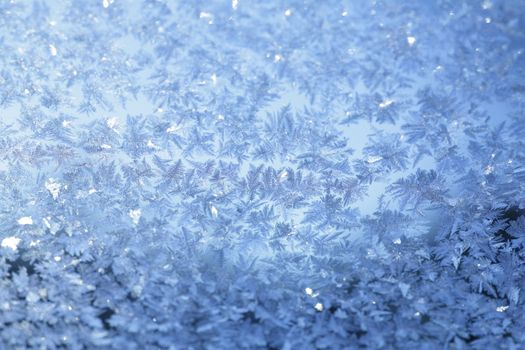 evening blue frost pattern texture on the glass