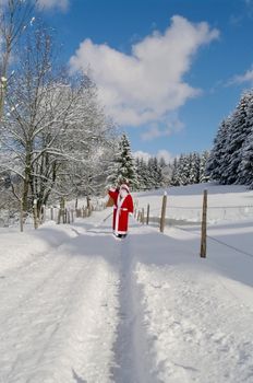 Santa Claus, Father Christmas in a beautiful winter landscape