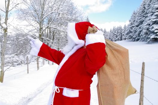 Santa Claus, Father Christmas in a beautiful winter landscape